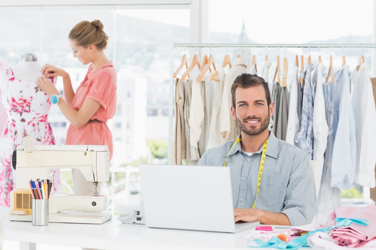 Related image man with laptop posing coworkers